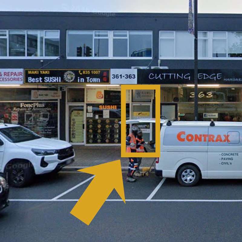 The front entrance to The Healing Centre Henderson on Great North Road, between the sushi shop and Cutting Edge Hairdressers